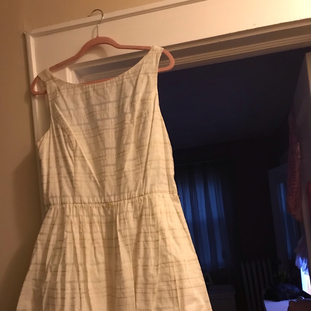 A white dress with gold